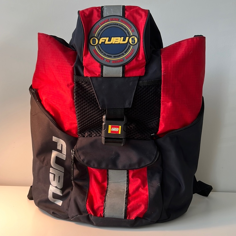 Large FUBU backpack. Expandable. Twin pockets on sides! Beautiful colors. Logo!